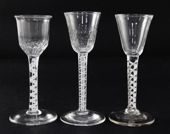 Two double series opaque twist stem wine glasses and an airtwist stem wine glass, c.1750-70, 15 - 15.5cm, latter two glasses chipped